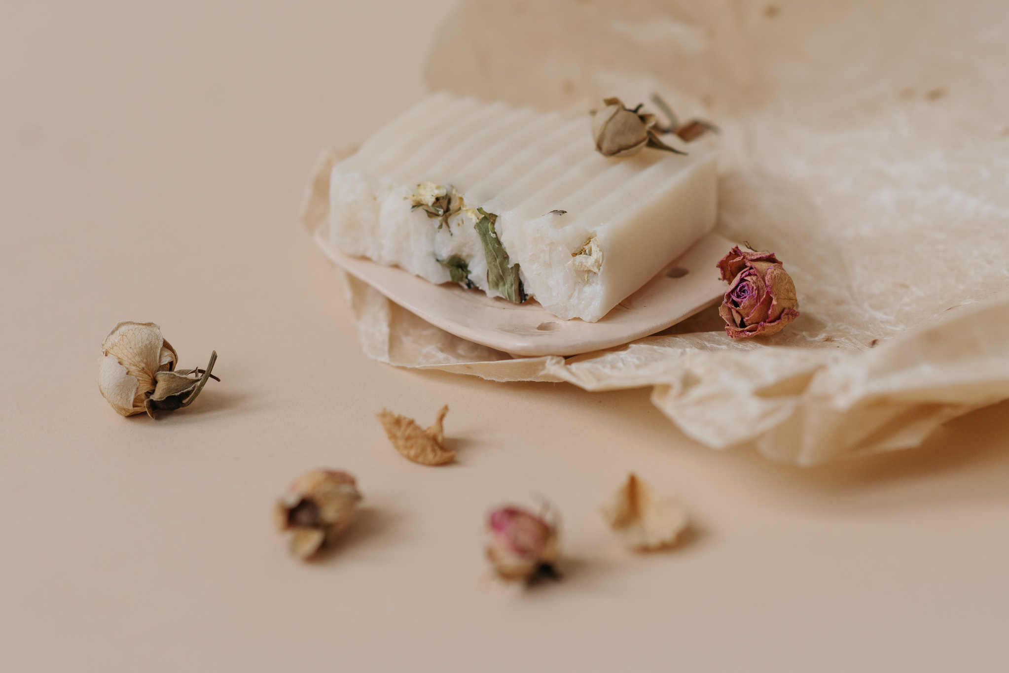 A Bar of Soap on a Beige Ceramic Dish